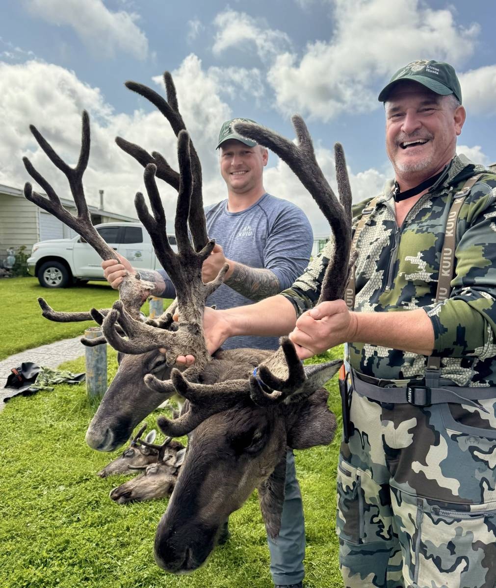 Two hunters with double Caribou trophy bulls