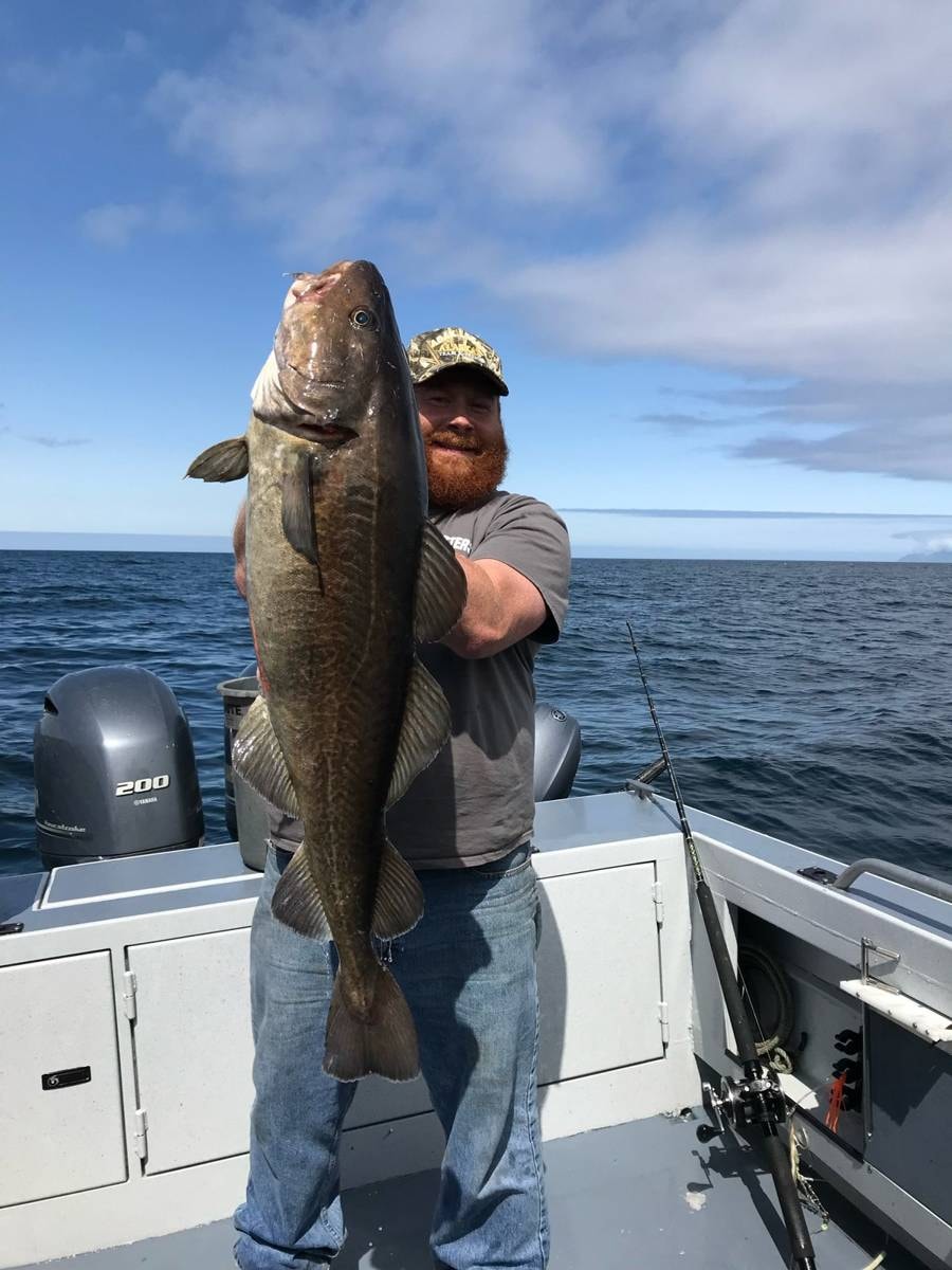 Man in camo with large rockfish