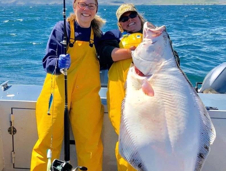Two women with trophy Halibut