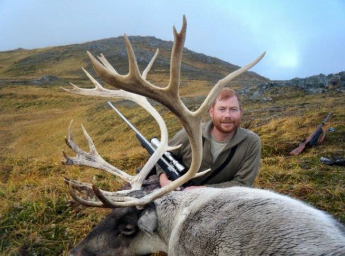 Hunter with a classic trophy Caribou rack on the ridge