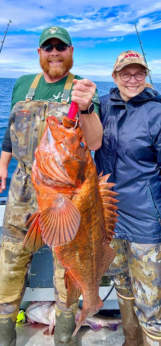 Couple on the boat with a trophy Rockfish