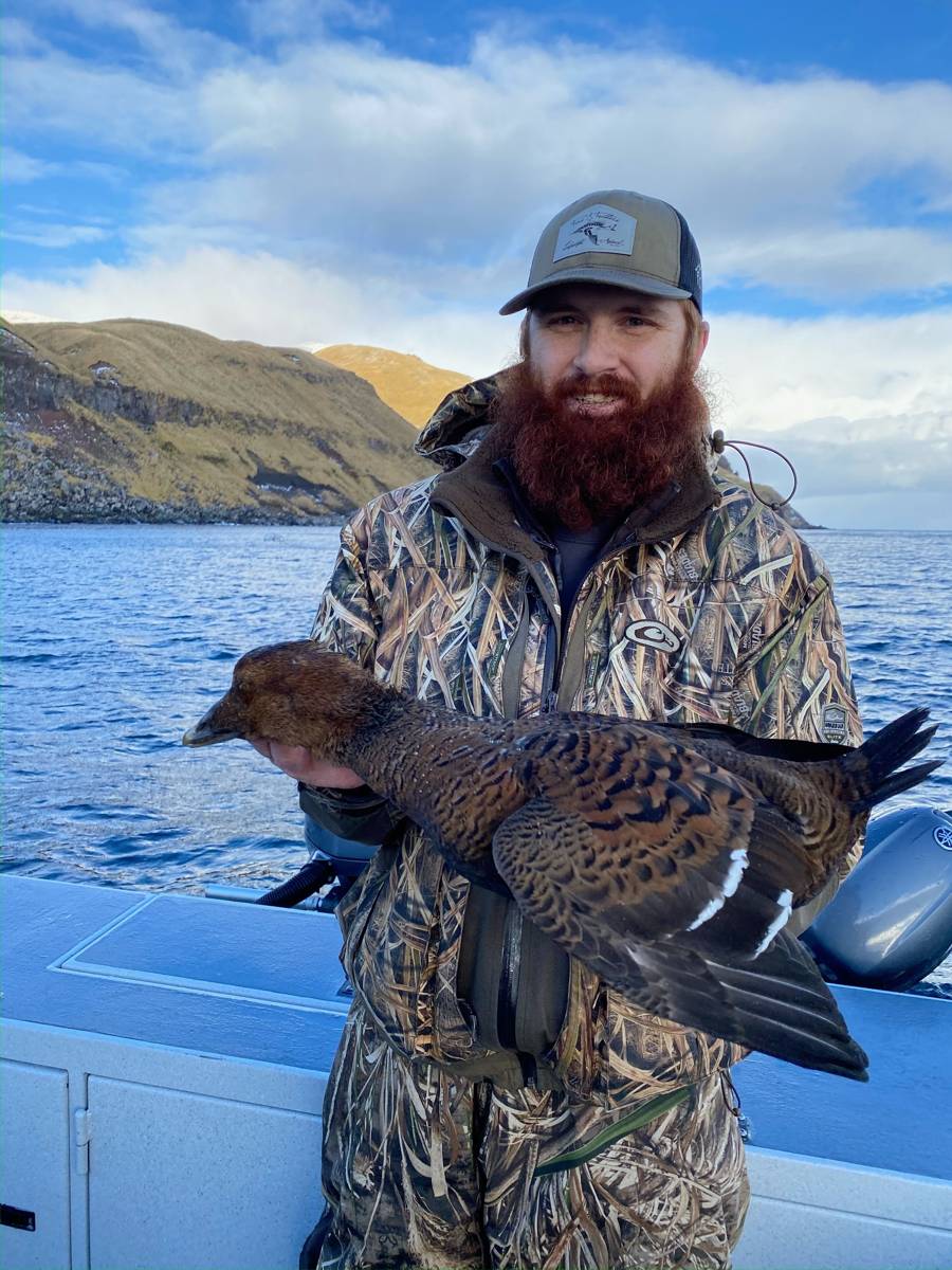 Hunter holding a duck